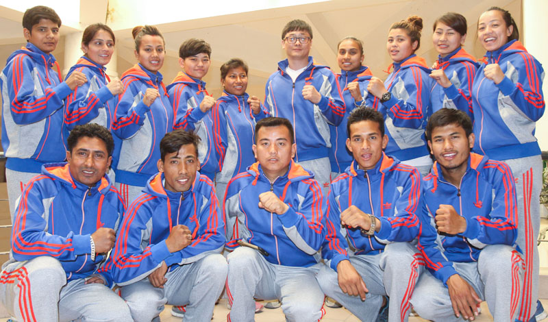 Taekwondo players and coaches pose for a group photo after a farewell programme in Lalitpur on Tuesday, April 12, 2016, ahead of their departure to the Philippines. Photo: THT