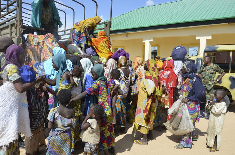 FILE - Women and children rescued by Nigerian soldiers from the Islamic extremist group Boko Haram in the northeast of Nigeria, arrive at the military office in Maiduguri, Nigeria, on July 30, 2015. Photo: AP
