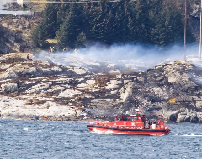 Rescuers work at a site where a helicopter has crashed, west of the Norwegian city of Bergen April 29, 2016.   NTB Scanpix/Bergens Tidende/via REUTERS