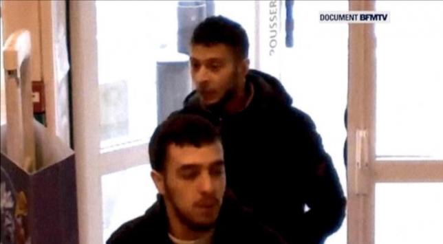 Paris shooting suspect, Salah Abdeslam, and suspected accomplice, Hamza Attou, are seen at a petrol station on a motorway between Paris and Brussels, in Trith-Saint-Leger, France in this still image taken from a November 14, 2015 video provided by BFMTV on January 11, 2016.  REUTERS/BFMTV via Reuters TV/Files