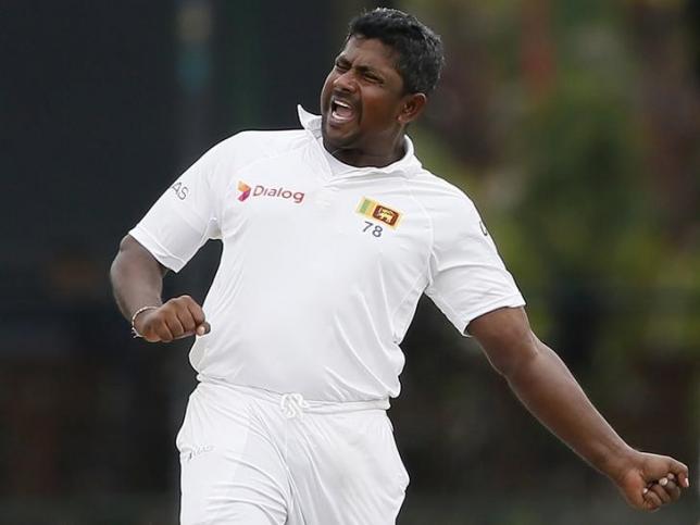Sri Lanka's Rangana Herath celebrates in test cricket match in Colombo October 26, 2015. REUTERS/Dinuka Liyanawatte/Files