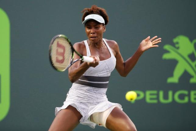 Mar 25, 2016; Key Biscayne, FL, USA; Venus Williams hits a forehand against Elena Vesnina (not pictured) during day four of the Miami Open at Crandon Park Tennis Center. Vesnina won 6-0, 6-7(5), 6-2. Mandatory Credit: Geoff Burke-USA TODAY Sports