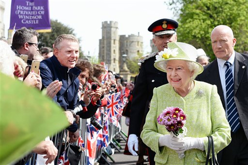 Queen Elizabeth II meets well wishers during a walkabout close to Windsor Castle as she celebrates her 90th birthday, in Berkshire, England, on Thursday, April 21, 2016. Photo: John Stillwell/Pool Photo via AP