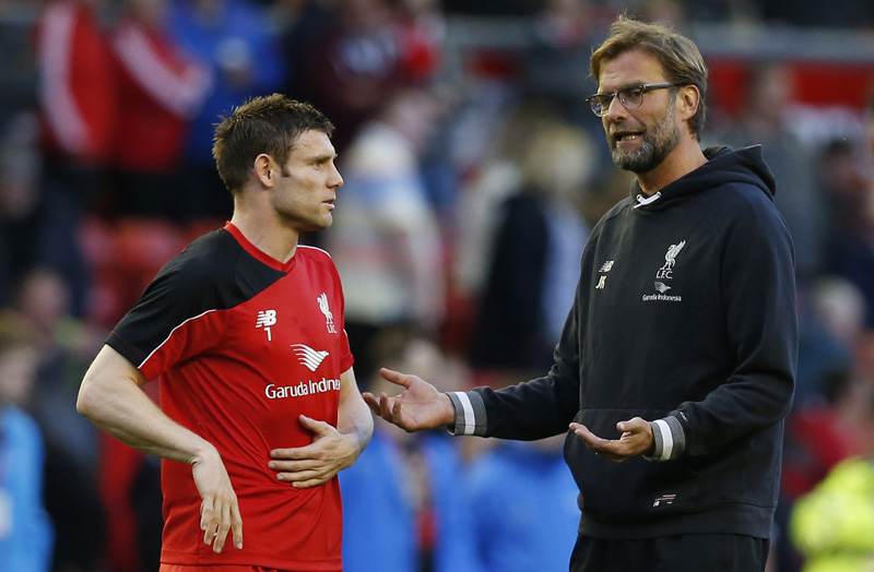 Liverpool manager Juergen Klopp with James Milner during the warm up before the match against Everton at Anfield on Wednesday, April 20, 2016. Photo: Reuters