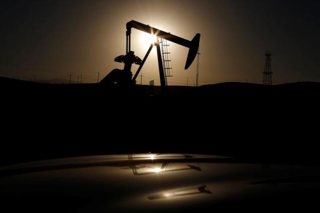 A pump jack is seen at sunrise near Bakersfield, California October 14, 2014. REUTERS/Lucy Nicholson