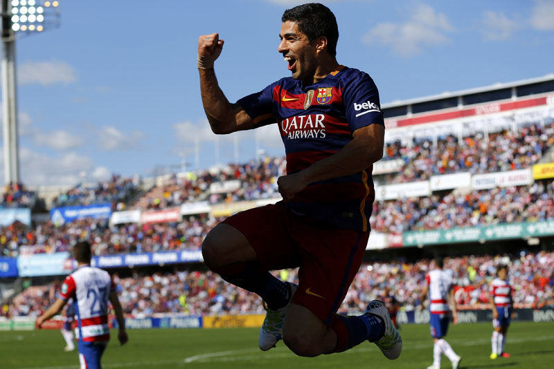 Barcelona's Luis Suarez celebrates after scoring a goal against Granada during their La Liga match in Granada on Saturday, May 14, 2016.  Photo: Reuters