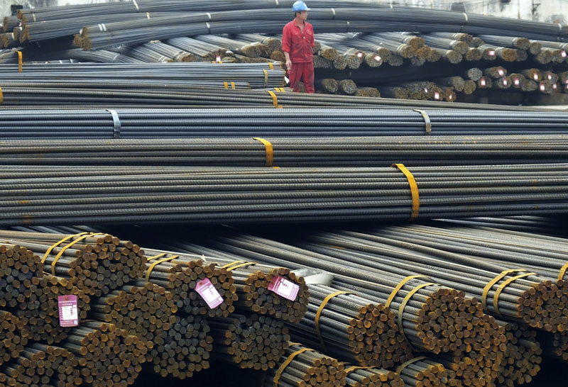 A man works in a steel market in Yichang in central China's Hubei province, on April 25, 2016. Photo: Chinatopix via AP
