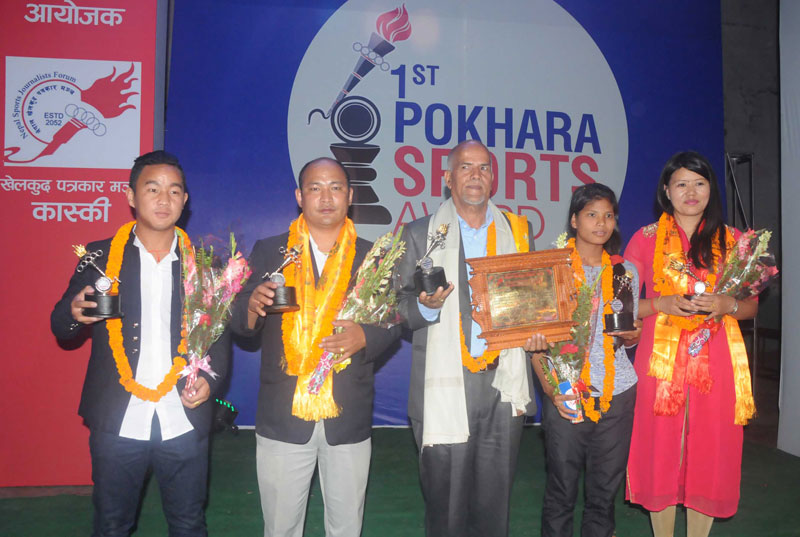 (From left) Footballer Heman Gurung, karate coach Surendra Gurung, football coach Krishna Thapa, athlete Shashi Chaudhary and spiker Manju Gurung after being honoured by Kaski nCoordination Committee of Nepal Sports Journalists Forum in Pokhara on Saturday. THT