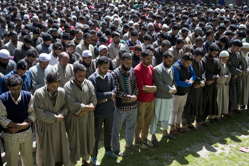 Kashmiri Muslim villagers pray as they participate in the funeral of Haseeb Ahmad, a suspected rebel, in Bandnu, 52 kilometres (33miles) south of Srinagar, Indian controlled Kashmir, on Saturday, May 7, 2016. Photo: Dar Yasin/AP