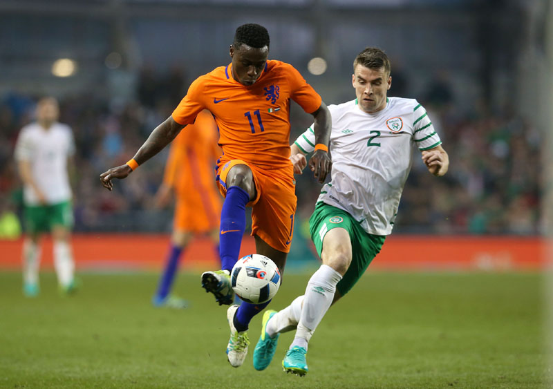 Netherlands' Quincy Promes (left) and Republic of Ireland's Seamus Coleman in action during the international friendly at the Aviva Stadium, Dublin, Ireland, on Friday, May 27, 2016. Photo: Brian Lawless/PA via AP