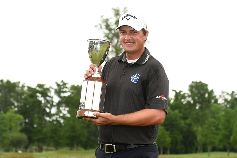 Brian Stuard of the USA holds the Zurich Classic trophy at the TPC Louisiana on Monday, May 2, 2016. Photo: AFP