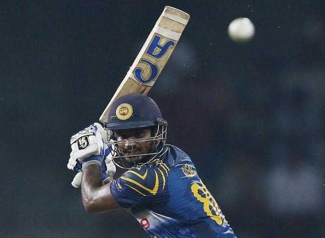 Sri Lanka's Kusal Perera hits a boundary during the second One Day International cricket match against West Indies in Colombo November 4, 2015. REUTERS/Dinuka Liyanawatte