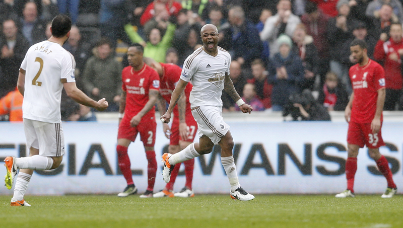 Swansea's Andre Ayew celebrates scoring their third goaln aginst Liverpool during Barclays Premier League game at Liberty Stadium on Sunday, May 1, 2016. Photo: Reuters