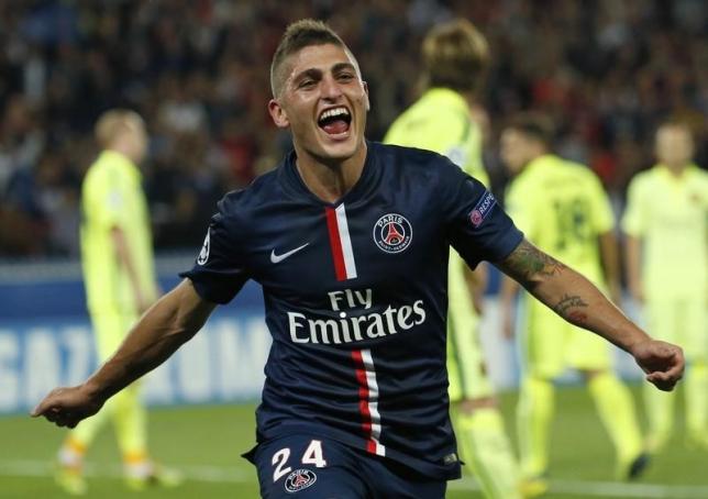 Marco Verratti celebrates after scoring against Barcelona during their Champions League Group F soccer match against Barcelona at the Parc des Princes Stadium in Paris, September 30, 2014. REUTERS/Benoit Tessier/Files
