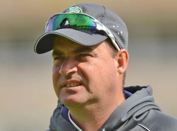 Australia's coach Mickey Arthur watches the team warm up before the ICC Champions Trophy Group A match against New Zealand at Edgbaston cricket ground in Birmingham in a June 12, 2013 file photo. Reuters
