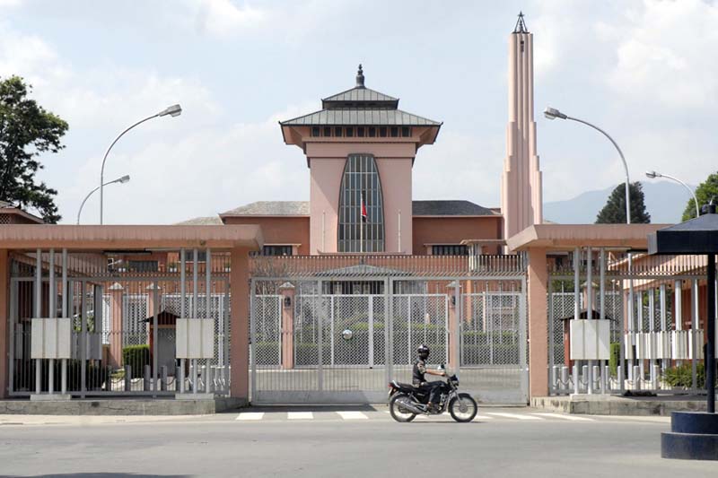 FILE - A motorcyclist passes by the Narayanhiti Durbar Museum in an undated file photo. Photo: THT