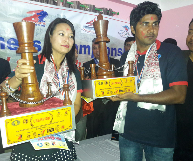 Monalisa Khamboo (left) and Bhupendra Niraula hold their trophies after winning the National Chess Championships in Ilam on Tuesday, May 24, 2016. Photo: THT