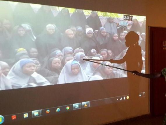 A student who escaped when Boko Haram rebels stormed a school and abducted schoolgirls, identifies her schoolmates from a video released by the Islamist rebel group at the Government House in Maiduguri, Borno State May 15, 2014.  REUTERS/Stringer/File photo