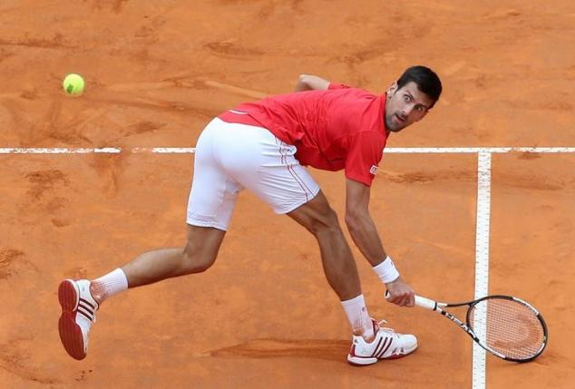 Tennis - Italy Open Men's Singles Quarterfinal match - Novak Djokovic of Serbia v Rafael Nadal of Spain - Rome, Italy - 13/5/16. Djokovic returns the ball.  REUTERS/Alessandro Bianchi