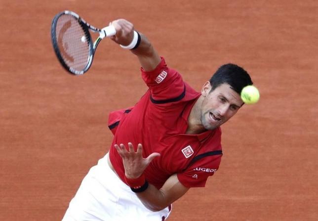 Tennis - French Open - Roland Garros - Novak Djokovic of Serbia v Aljaz Bedene of Britain - Paris, France - 28/05/16. Djokovic serves.  REUTERS/Jacky Naegelen