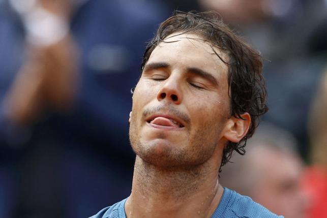 File Photo Tennis - French Open - Roland Garros - Rafael Nadal of Spain vs Facundo Bagnis of Argentina - Paris, France - 26/05/16. Nadal reacts. Nine-times French Open champion Nadal pulled out of the French Open May 27, 2016 because of a left wrist injury.  REUTERS/Pascal Rossignol/File Photo