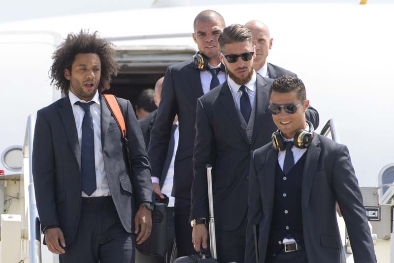 (From left) Real Madrid's Marcelo, Pepe, Sergio Ramos and Cristiano Ronaldo, get off the plane after landing at Malpensa airport in Milan, Italy, on Friday, May 27, 2016. Photo: UEFA via AP