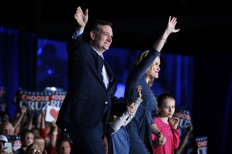 Republican presidential candidate Senator Ted Cruz, R-Texas, waves with his wife Heidi and daughters, Caroline (right) and Catherine, during a rally at the Indiana State Fairgrounds in Indianapolis, on Monday, May 2, 2016. Photo: Michael Conroy/AP