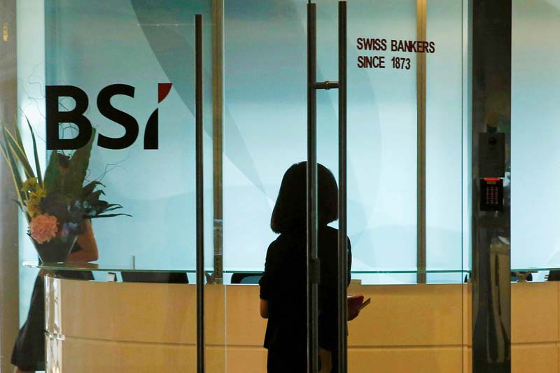 An employee enters the reception area of the Swiss bank BSI's office in Singapore on May 24, 2016. Photo: Reuters
