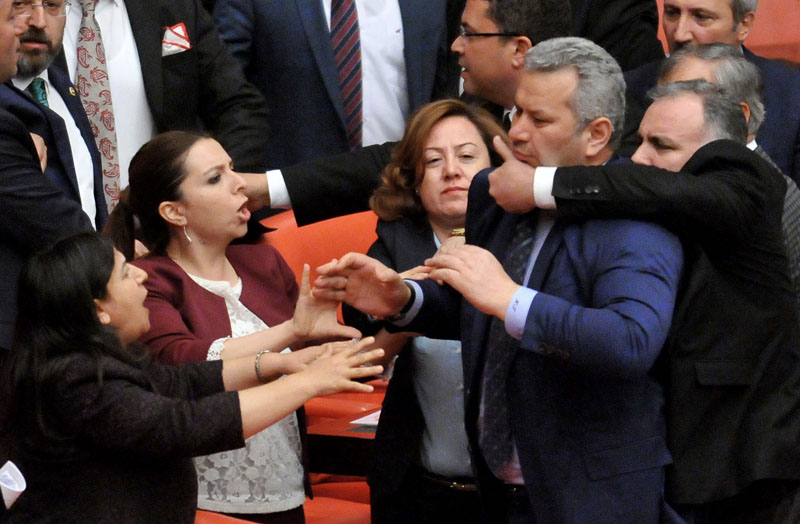Turkish lawmakers argue and push each other on the assembly floor in Ankara, Turkey, late Wednesday, April 27, 2016.  Turkish lawmakers on Thursday argued and pushed each other as they debated a contentious ruling-party proposals. Photo: AP