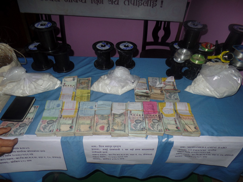 Police make public drugs and cash seized from alleged members of an international drug smuggling racket, in Kathmandu, on Wednesday, May 25, 2016. Photo: NCB