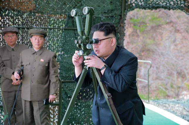 North Korean leader Kim Jong Un guides on the spot the underwater test-fire of strategic submarine ballistic missile in this undated photo released by North Korea's Korean Central News Agency (KCNA) in Pyongyang on April 24, 2016. KCNA/via REUTERS
