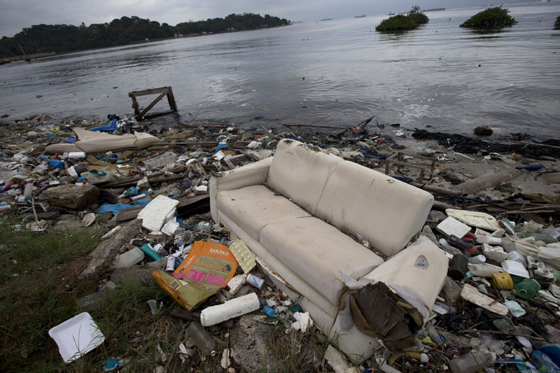 FILE -  A discarded sofa litters the shore of Guanabara Bay in Rio de Janeiro, Brazil, on June 1, 2015. Photo: AP