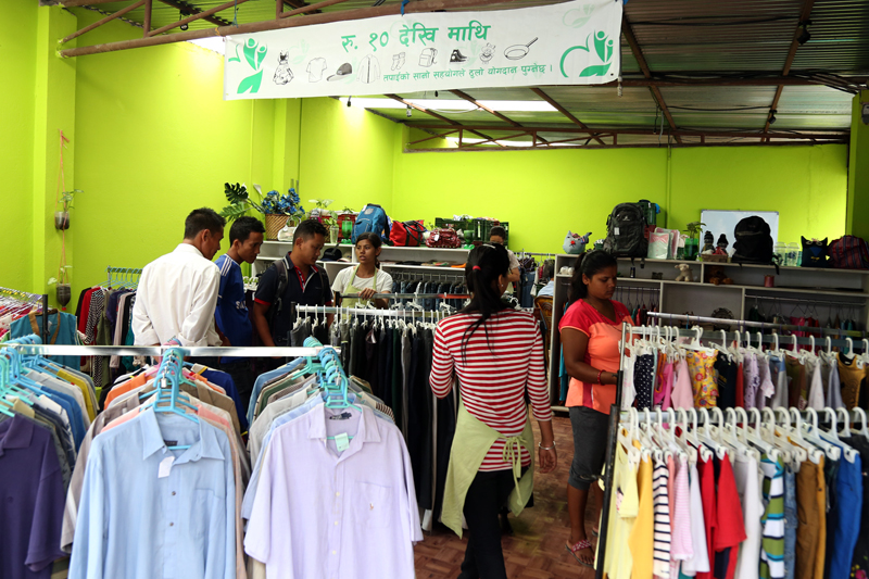 Customers at a store that sells reconditioned goods including garments and kitchen utensils, in Samakhusi of Kathmandu, on Saturday, June 25, 2016. Photo: RSS