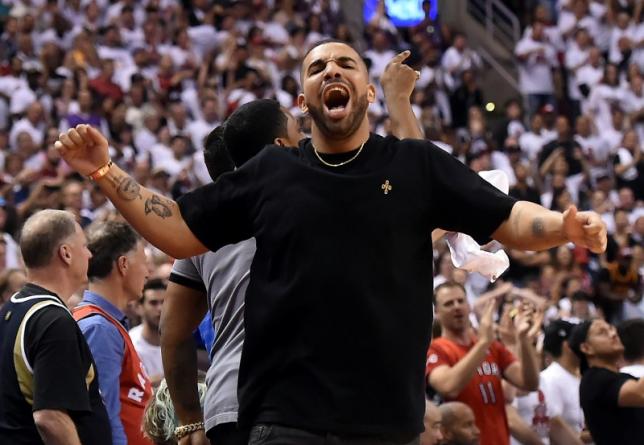 May 23, 2016; Toronto, Ontario, CAN;   Recording artist Drake celebrates after Toronto Raptors score a basket in a 105-99 win over Cleveland Cavaliers in game four of the Eastern conference finals of the NBA Playoffs at Air Canada Centre. Mandatory Credit: Dan Hamilton-USA TODAY Sports