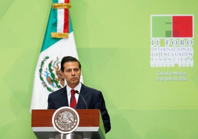 Mexico's President Enrique Pena Nieto gives a speech next to Queen Maxima of the Netherlands (not pictured) during the International Forum of Financial Inclusion at the National Palace in Mexico City, Mexico June 21, 2016. REUTERS/Henry Romero