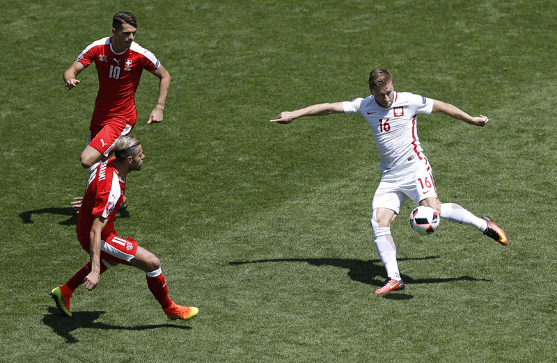 Poland's Jakub Blaszczykowski shoots at the goal during the Euro 2016 round of 16 soccer match between Switzerland and Poland, at the Geoffroy Guichard stadium in Saint-Etienne, France, on Saturday, June 25, 2016. Photo: AP