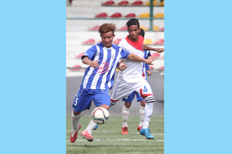 Players of Jhamsikhel (left) and Shree Bhagwati vie for the ball during their Martyrs Memorial Red Bull C Division League match in Lalitpur on Thursday, June 23, 2016. Photo:Udipt Singh Chhetry/ THT