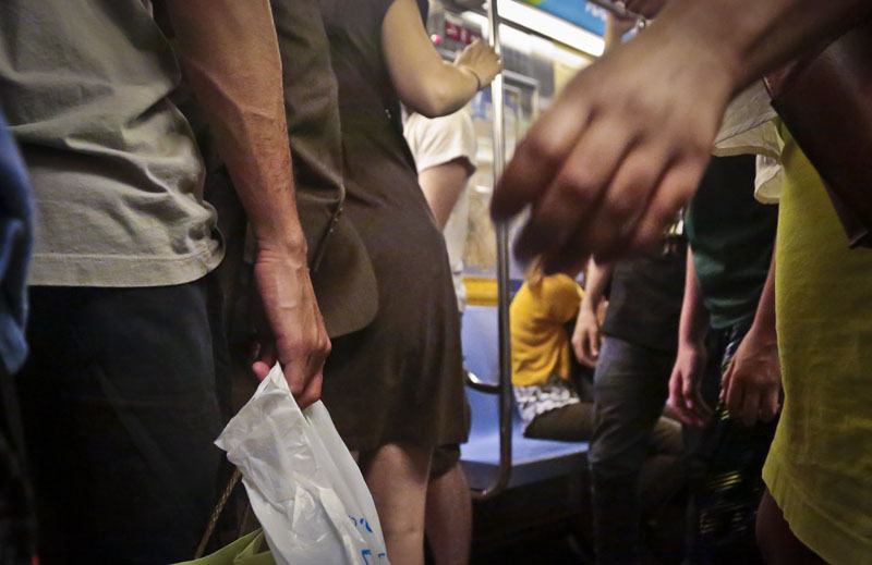 Subway riders board a train during rush hour, on Wednesday, June 22, 2016, in New York. As subway ridership reaches an all-time record, police say reports of sex offenses underground are also on the rise, up nearly 57 percent from last year. Photo: AP