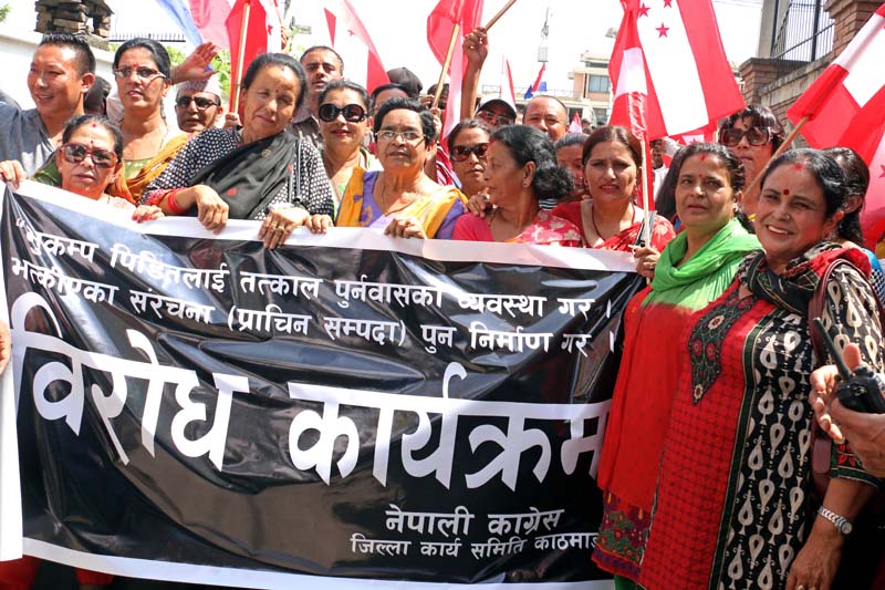 Nepali Congress cadres state a protest demanding immediate support for shelter to earthquake survivors, at the District Administration Office, in Babarmahal, on Sunday, June 26, 2016. Photo: RSS