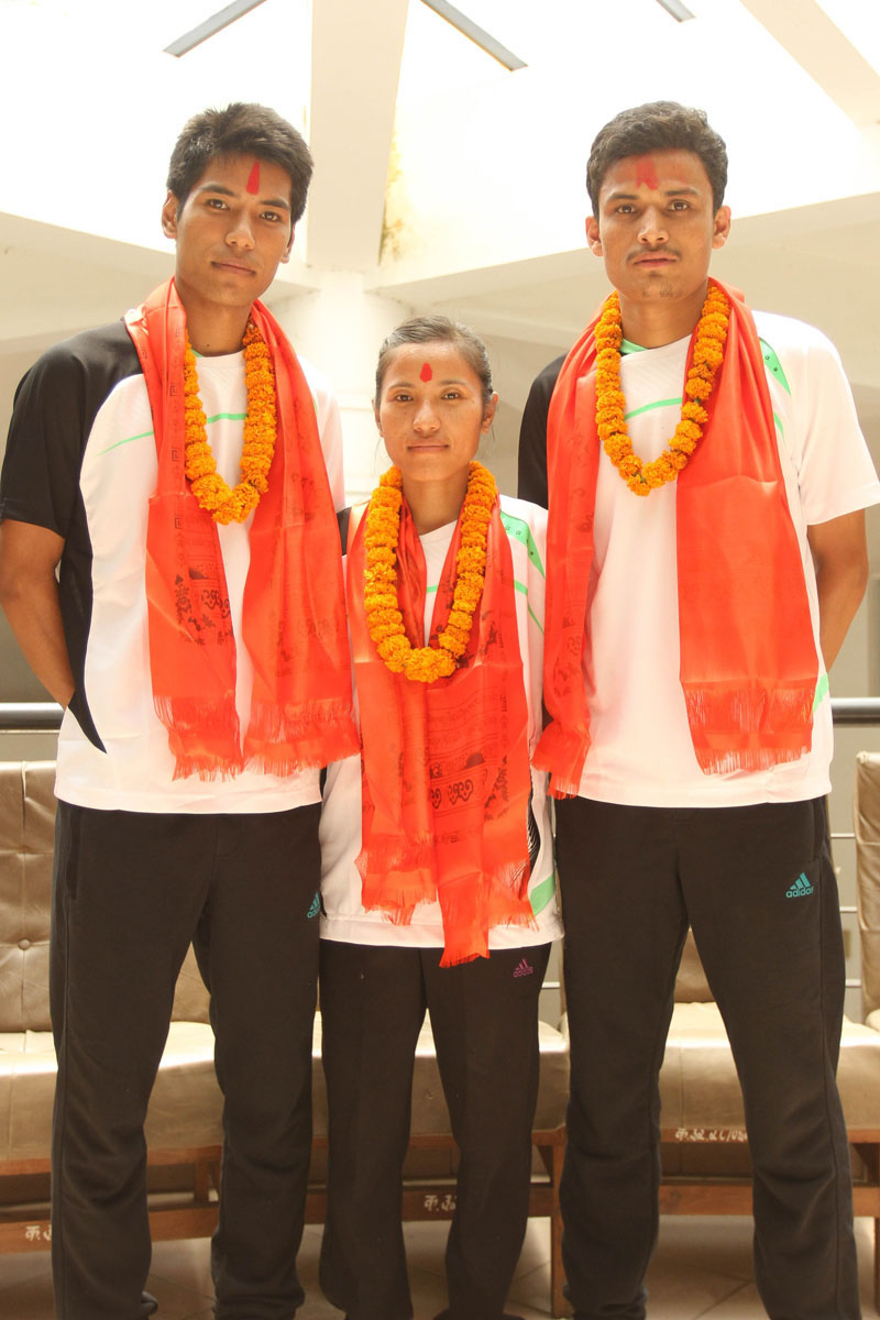 (From left) Shuttlers Ratnajit Tamang, Nangsal Devi Tamang and Bikash Shrestha at a farewell in Lalitpur on Wednesday. Photo: Udipt Singh Chhetry/THT