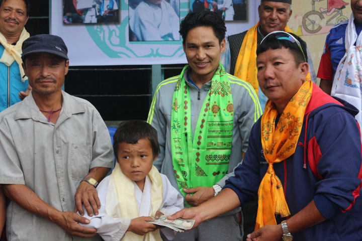 12-year-old Rajendra Rai receives financial assistance of Rs 10,000 and karate kits worth Rs 45,000 from Kirat Rai Sports Association and National Institute of Sports at National Sports Council on Monda, June 20, 2016. Photo: THT
