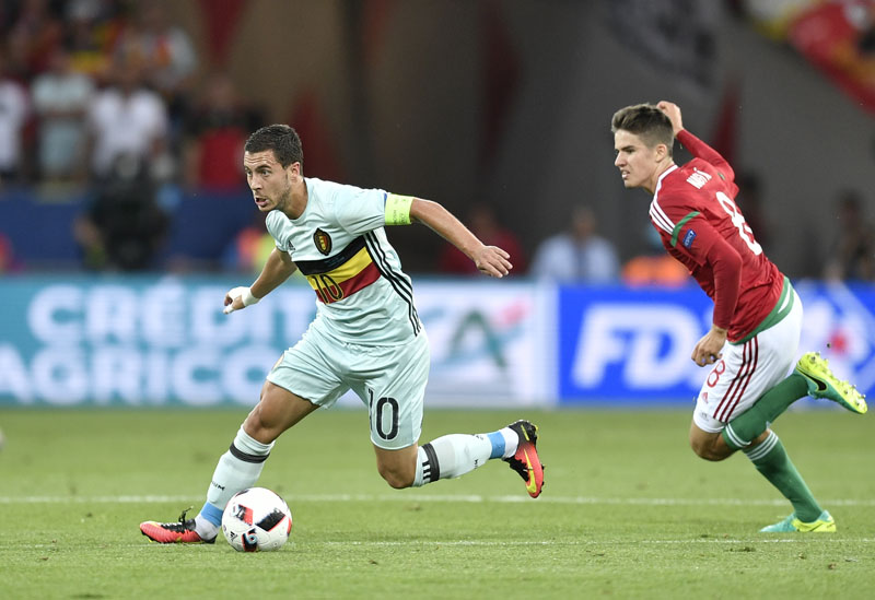 Belgium's Eden Hazard escapes Hungary's Adam Nagy (right) during the Euro 2016 round of 16 soccer match between Hungary and Belgium, at the Stadium municipal in Toulouse, France, on Sunday, June 26, 2016. Photo: AP
