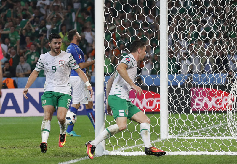 Ireland's Robbie Brady (right) celebrates after scoring, during the Euro 2016 Group E soccer match between Italy and Ireland at the Pierre Mauroy stadium in Villeneuve du2019Ascq, near Lille, France, on Wednesday, June 22, 2016. Photo: AP