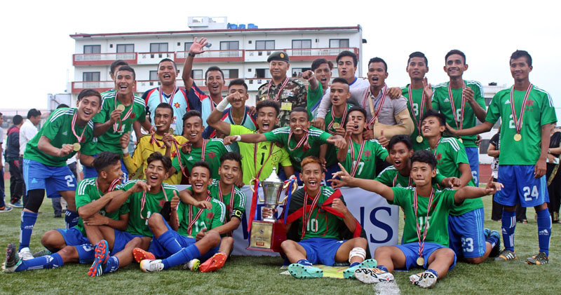 Tribhuvan Army Club players and officials celebrate after winning the Lalit Memorial U-18 Football Tournament at the ANFA Complex grounds in Lalitpur on Wednesday, June 29, 2016. Photo: THT