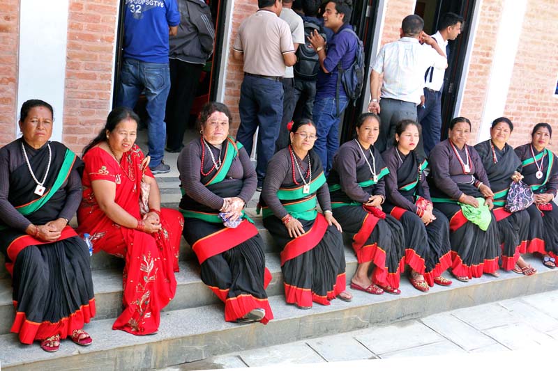 Women dressed in hakku patasi, a traditional Newari attire, attend the inauguration ceremony of the CPN-UML's Lalitpur District Party Office on the occasion of Madan u2013 Ashrit Memorial Day, on Tuesday, June 28, 2016. Photo: RSS