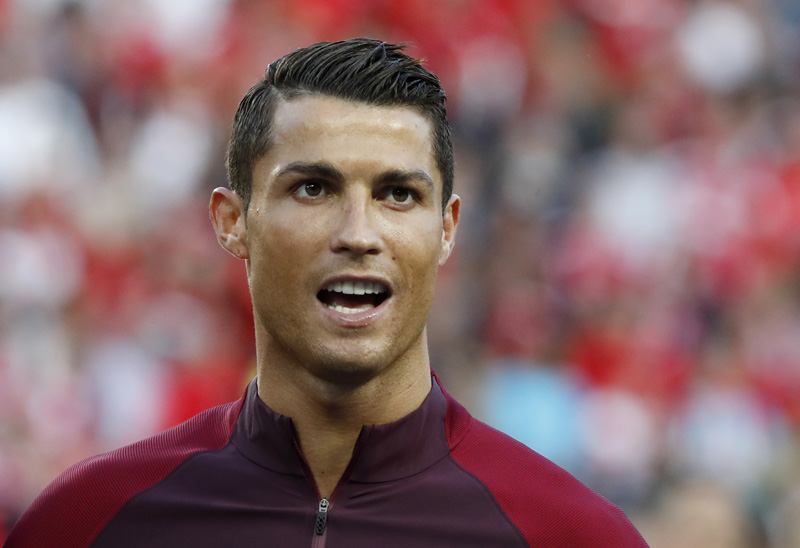 Portugal's Cristiano Ronaldo lines up during the national anthemsn at Euro 2016 Group F Soccer match between Portugal and Austria at Parc des Princes in Paris on June 18, 2016. Photo: Reuters
