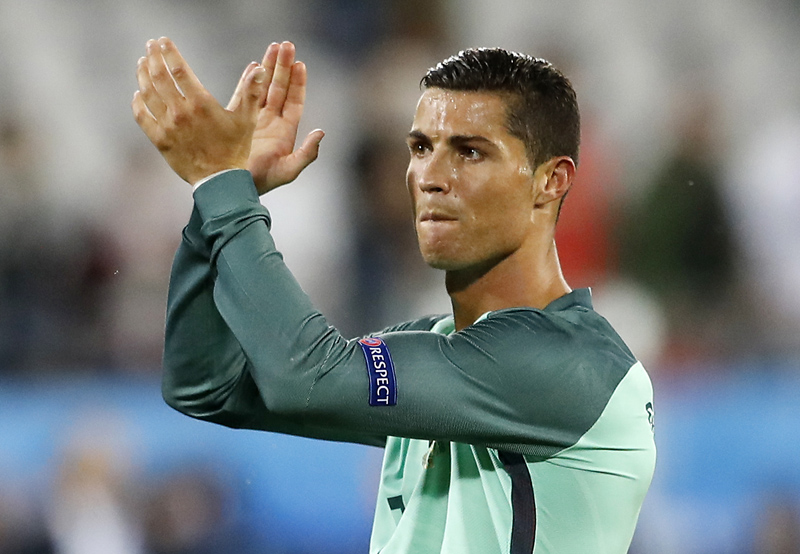 Portugal's Cristiano Ronaldo applauds fans at the end of  the Euro 2016 round of 16 soccer match between Croatia and Portugal at the Bollaert stadium in Lens, France, Saturday, June 25, 2016. Photo: AP