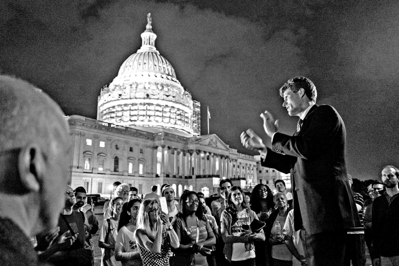 Joe Kennedy applauds supporters of House Democrats taking part in a sit-in on the House Chamber outside the US Capitol in Washington, DC, on Thursday, June 23, 2016. Photo: AFP