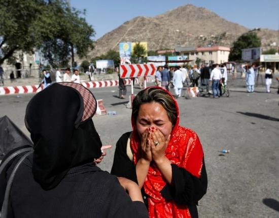 An Afghan woman weeps at the site of a suicide attack in Kabul, Afghanistan July 23, 2016. REUTERS/Mohammad Ismail