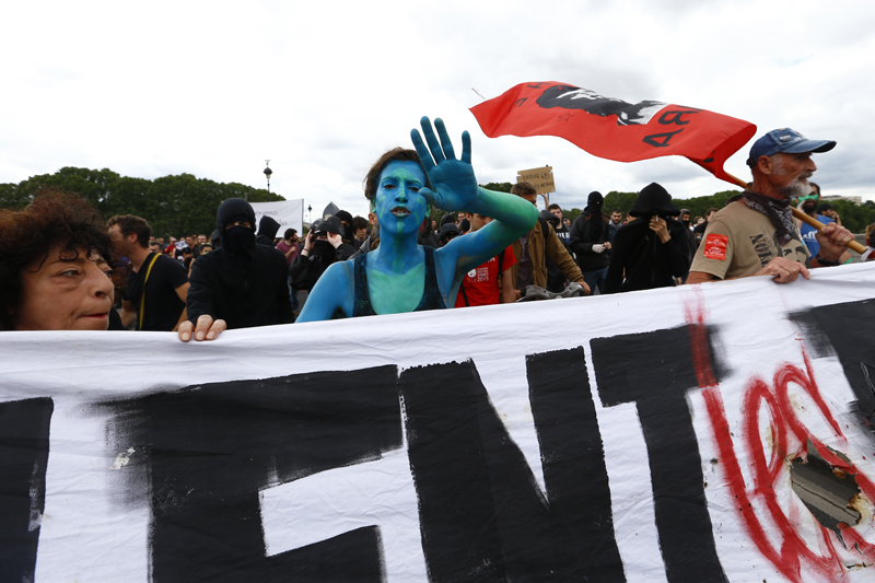 People march during a demonstration in Paris, Tuesday, July 5, 2016.Photo: AP